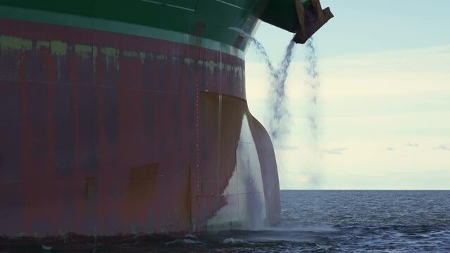 Tanker ship without cargo. Underwater part of vessel above water. Bow bulb. Anchor outside washed with water.