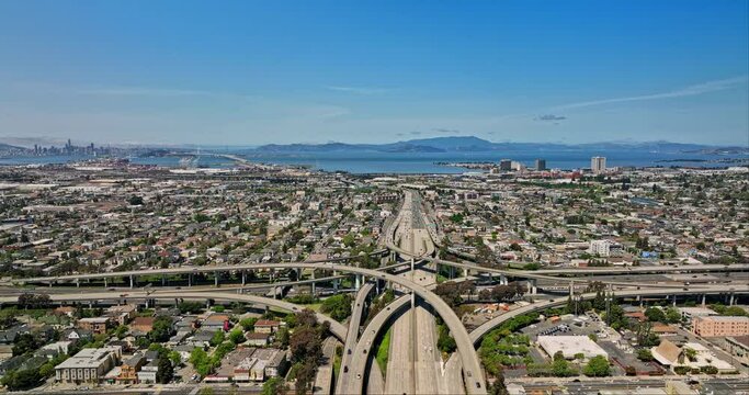 Oakland California Aerial v7 reverse flyover above macarthur highway capturing cityscape of nearby neighborhoods with san francisco bay area in the background - Shot with Mavic 3 Cine - April 2022