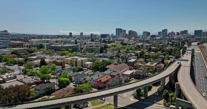 Oakland California Aerial v9 drone flyover elevated interstate highway capturing inner city suburb pill hill neighborhood and downtown cityscape in the background - Shot with Mavic 3 Cine - April 2022