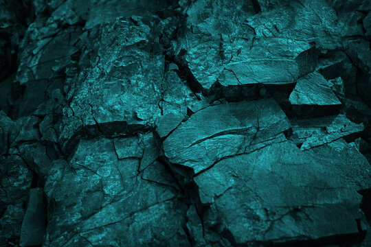 Blue green rock texture. Toned cracked crumbled rough mountain surface. Close-up. Dark teal color. Colorful background for design. Fantasy, fantastic, mystic. © Наталья Босяк