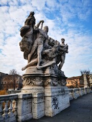 Vertical shot of sculpture on Ponte Vittorio Emanuele II bridge in Rome, Italy