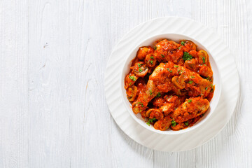 chicken stew with mushrooms in a tomato sauce