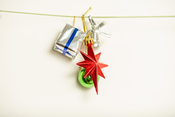 Christmas gifts are hanging on isolated white background