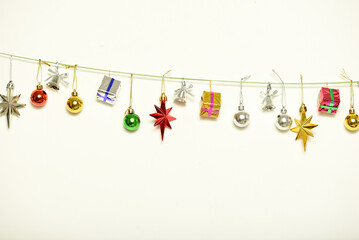 Christmas gifts are hanging on isolated white background