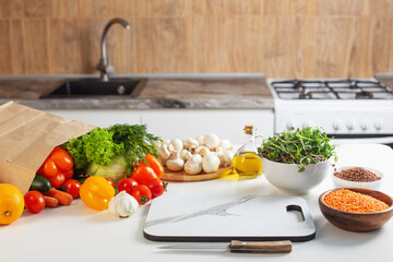 fresh health vegetarian food on white table in kitchen