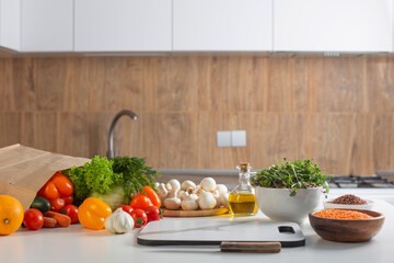 fresh health vegetarian food on white table in kitchen