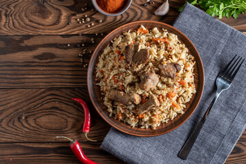 pilaf with meat vegetables and spices on a plate traditional asian food