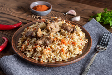 rice with meat vegetables and spices on a plate traditional asian food