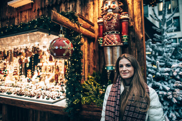 Girl in Winter lights Christmas market in the center of Luxembourg city