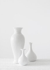 ceramic white vases on white background