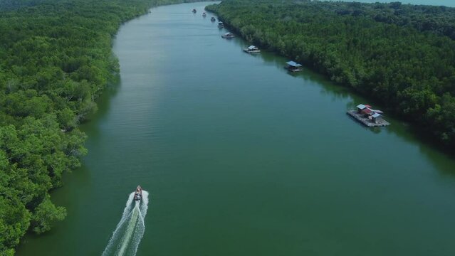 Drone View of boat cruising on Bagan Lalang river at morning, Sepang, Malaysia