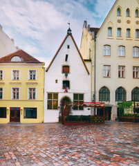 Medieval architecture in Tallinn, Estonia. Street cafe, restaurants, coffee shops in historic...