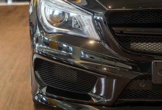 Black Mercedes-Benz AMG CLA 45 Headlight front end, right part of the car