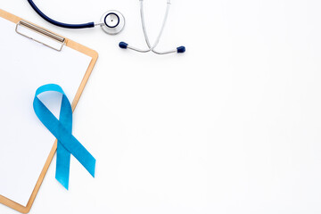 Prostate cancer awareness ribbon with stethoscope. Male medical checkup concept