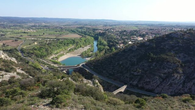 Discovering herault river with bridges pont du diable aerial view sunny day Saint jean de Fos
