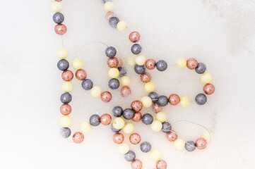 Multi-colored beads in foam. view from above