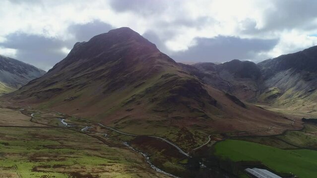 Aerial Drone Shot Around Fleetwith Pike Buttermere in Stunning Lighting Conditions Cloudy with Bursts of Sunshine near Honister Pass Lake District Cumbria United Kingdom