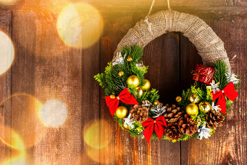 New Year's holiday wreath on an old wooden wall. christmas background