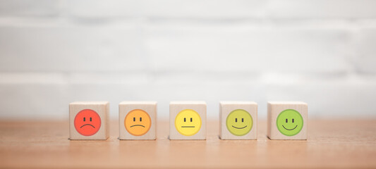 Wooden cube with icon emotion face, Satisfaction survey concept. customer experience, best...