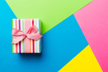 holiday paper present tied pink ribbon bow top view with copy space. Flat lay holiday background....