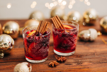 Cozy close-up of two glasswes with mulled wine. Christmas drink