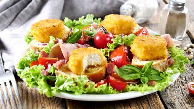 mixed vegetable salad and toast with goat cheese