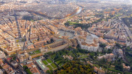 Aerial view of Papal Basilica of Saint Peter in the Vatican located in Rome, Italy. It's the most important and largest church in the world and residence of the Pope. Around it are the Vatican gardens