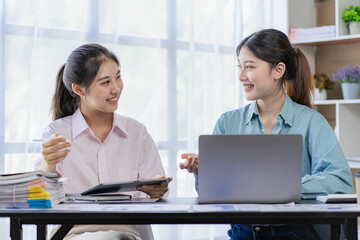 Business meeting.Two women discussing business in modern office.General account manager working on startup project on laptop. Financial accounting presentation, teamwork concept