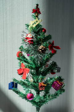 Small decorated Christmas tree during Christmas festival and New Year celebration.