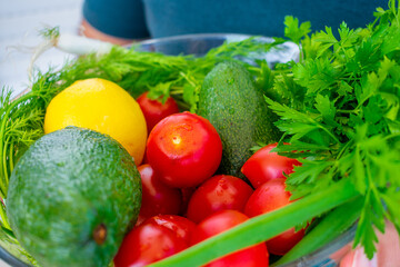Vegetables on a white plate. Tomatoes and avocados.
