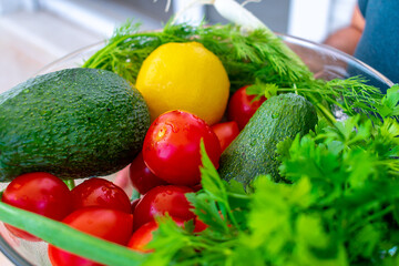 Vegetables on a white plate. Tomatoes and avocados.