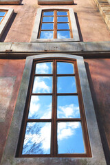 blue sky reflected in long window