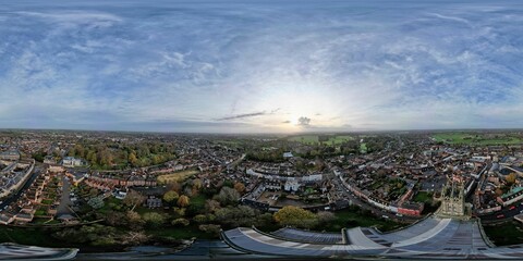 Aerial panoramic shot of old buildings surrounded by trees, Warwickshire, UK