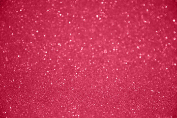 Glitter sparkling red, magenta texture. Beautiful Christmas and new year bokeh blurred background