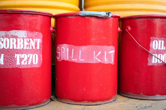 Spill kit or oil sorbent containment boxes are prepared and placed in front of the chemical storage room. Using in emergency case of chemical spill or leak on ground.