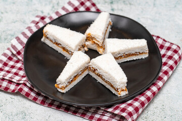 Coconut Cookies. Hazelnut cookies with honey on a gray background. Cookies with coconut and hazelnut filling. close up
