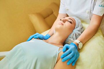 Cosmetic procedures for a young girl. The office of a cosmetologist doctor. Beauty and health.