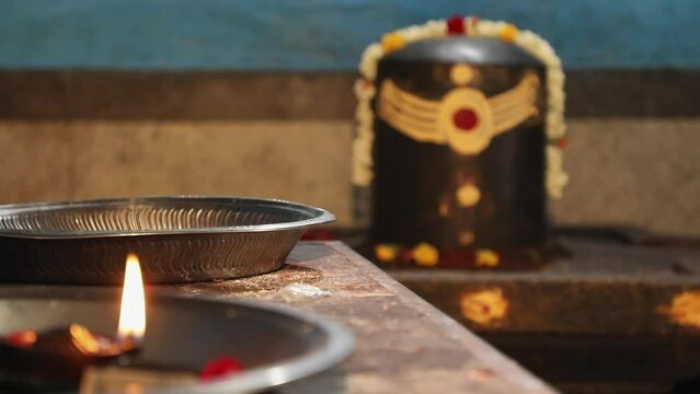 Point of view clay lamp or diya lamp and lingam or shiv ling