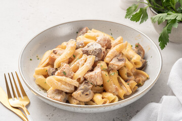 Pasta with chicken and cream mushroom sauce