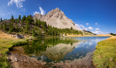 Fototapeta na wymiar Summer view of Lauzet Lake above the village of Saint-Crepin in the Hautes-Alpes. Alps, France