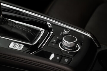 Car media controller close up. Modern car media and navigation control buttons