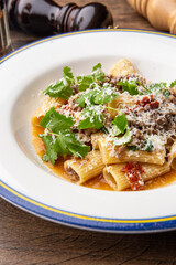 Pasta bolognese with sun-dried tomatoes and parmesan