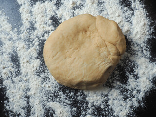 Fresh yeast dough on a kitchen countertop