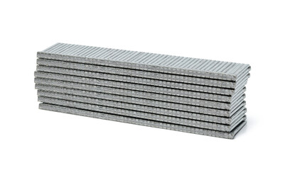 Metal nails for a mechanical stapler gun on a white isolated background