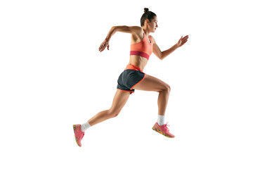 Fototapeta na wymiar Dynamic portrait of professional female athlete, runner or jogger wearing summer sportswear running isolated on white background. Sport, fitness, motion, competition
