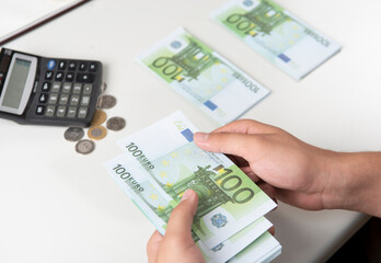 Man counting money, economy concept, allocation of money.Euro. Crisis after the covid-19 epidemic .Dollar falling or rising.