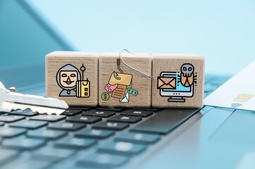 phishing or scaming concept on cube blocks on blue background with copy space