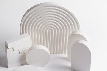 White props for product photography on white seamless background - half-circles, oval doors,...