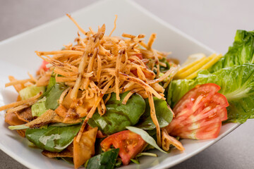 fatoush salad served in dish isolated on grey background top view of arabic food