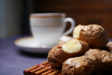 Ginger tea on wooden background.